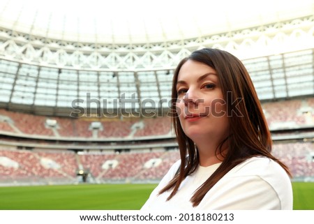 Portrait of woman posing at football stadium Royalty-Free Stock Photo #2018180213