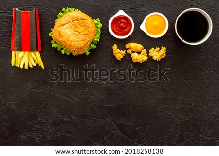 Fried chicken nuggets and burger potatoes with sauce