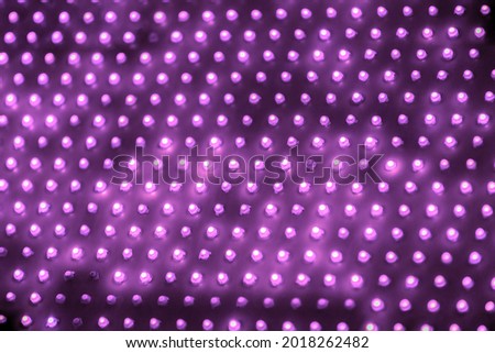 cheap outdoor purple screen led panel with individual diodes, full frame close-up view with selective focus