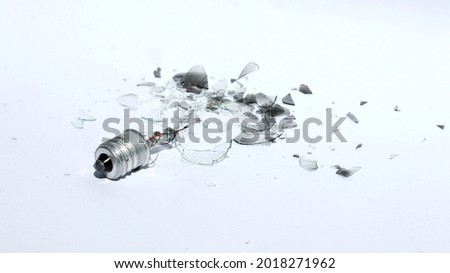 
Broken Light Bulb on white background. The broken glass from the bulb was broken. 	 Royalty-Free Stock Photo #2018271962