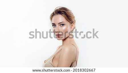 Portrait of a young woman with natural makeup and natural styling.Advertising natural cosmetics.Advertising for a beauty salon.Care cosmetics, face and body skin care. Royalty-Free Stock Photo #2018302667