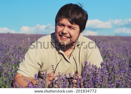 Man in a lavender field. Photo toned style Instagram filters
