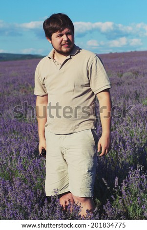 Man in a lavender field. Photo toned style Instagram filters