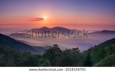 Sunrise from Blue Ridge Parkway in fall. Royalty-Free Stock Photo #2018358701