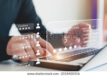 User gives rating to service experience on online application, Customer review satisfaction feedback survey concept, Customer can evaluate quality of service leading to reputation ranking of business. Royalty-Free Stock Photo #2018400356