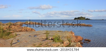 Rock formation and island in Vita Sannar, Sweden. Lake Vanern.