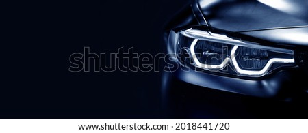 Detail on one of the LED headlights modern car on black background,	free space on left side for text. Royalty-Free Stock Photo #2018441720