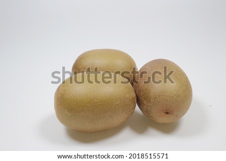 Golden kiwi fruits or Chinese gooseberries isolated on white background.