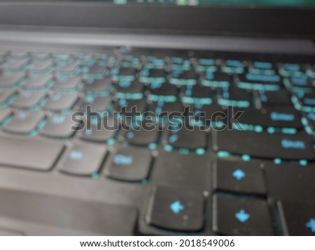 Defocused image of blue backlit keyboard