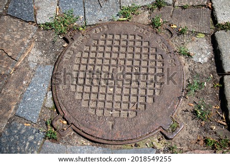 old city rusty manhole iron