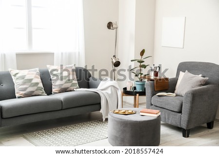 Armrest table on armchair in interior of room Royalty-Free Stock Photo #2018557424