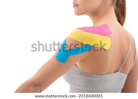 dynamic functional bandage with taping on female shouder isolated on white background Royalty-Free Stock Photo #2018600081