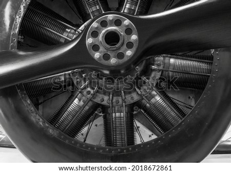 vintage propellor aeroplane engine close up showing the air cooled cylinders, in black and white. High quality photo Royalty-Free Stock Photo #2018672861