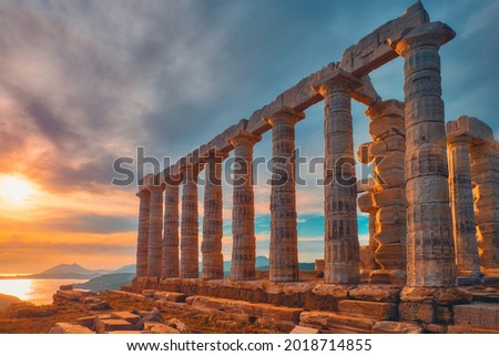 Greece Cape Sounio. Ruins of an ancient temple of Poseidon, Greek god of the sea, on sunset. Shot of temple ruins on sunset. Tourist landmark of Attica, Sounion, Greece Royalty-Free Stock Photo #2018714855