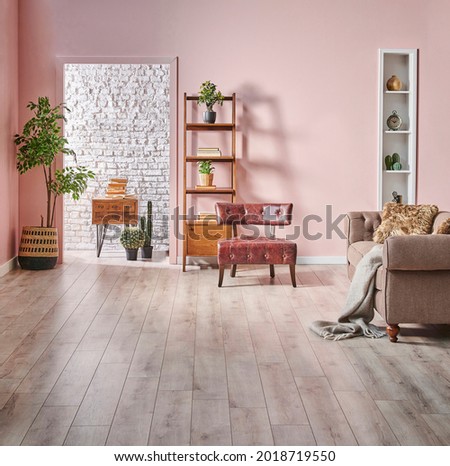 Pink and white brick wall background bookshelf wooden cabinet and green plant, interior style.
