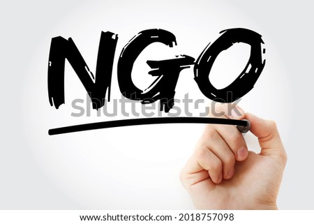 NGO - Non-Governmental Organization is an organization that generally is formed independent from government, acronym text concept with marker