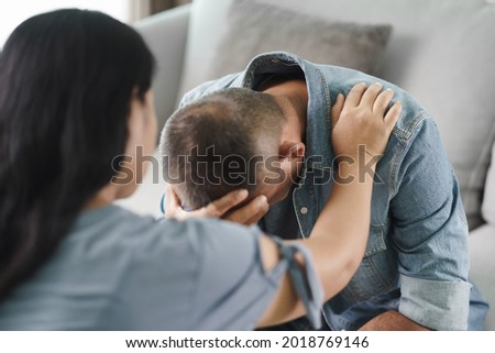 Female Psychologist, friend or family sitting and put hands on the shoulder for cheer up to mental depress man, Psychologist provides mental aid to the patient. PTSD Mental health concept
 Royalty-Free Stock Photo #2018769146