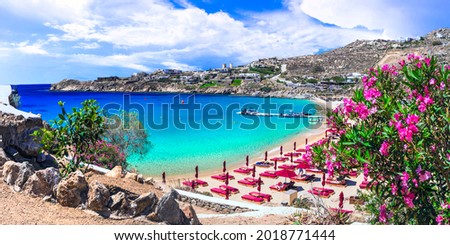 Greece summer holidays. Cyclades .Most famous and beautiful beaches of Mykonos island - Super Paradise beach popular tourist resort Royalty-Free Stock Photo #2018771444