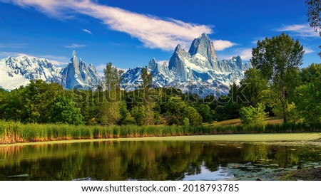 A body of water with a mountain in the background