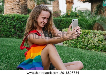 lgtbi woman takes a selfie in the park