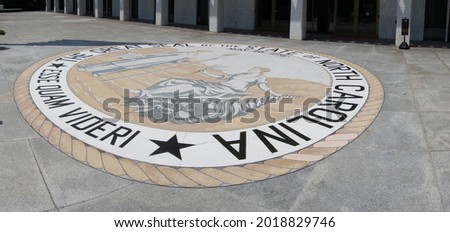The front entrace of the North Carolina State Legislature building in Raleigh with the state seal and motto - Esse Quam Videri -- To Be, Rather Than To Seem                                Royalty-Free Stock Photo #2018829746