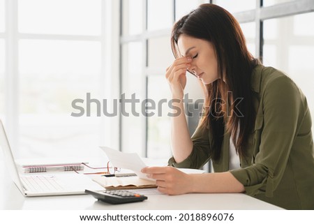 Young tired stressed overworked businesswoman freelancer teacher student exhausted after hard work, suffering from migraine headache at office. Deadline, fired worker, debt, problems concept Royalty-Free Stock Photo #2018896076