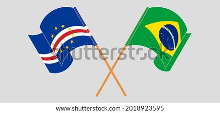 Crossed and waving flags of Cape Verde and Brazil
