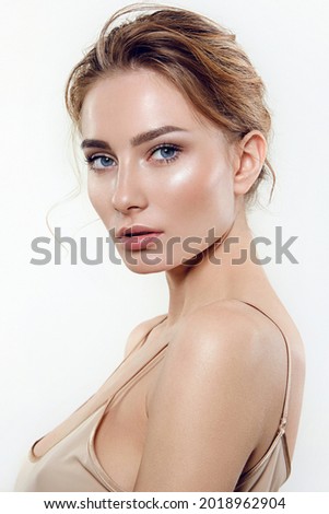 Portrait of a young woman with natural makeup and natural styling.Advertising natural cosmetics.Advertising for a beauty salon.Care cosmetics, face and body skin care. Royalty-Free Stock Photo #2018962904