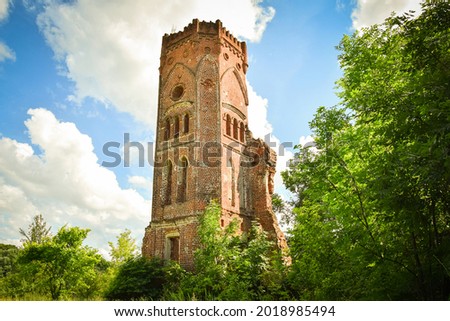 A crumbling corner tower of provincial Gothic. The village of Veshalovka. Lipetsk region. Russia. July 2020