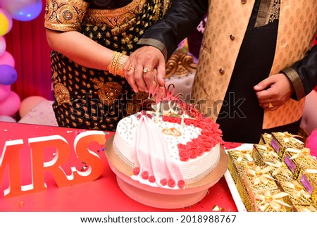 Wedding decoration, cake topper, Mr and Mrs cutting the cake  White cake with red flower