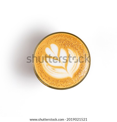Coffee in a transparent glass coffee cup. The cup is on a white background 