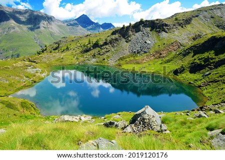 Mountain lake Lago di Loie in National park Gran Paradiso, Lillaz, Cogne, Aosta valley, Italy. Summer landscape in the Alps. Royalty-Free Stock Photo #2019120176
