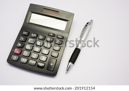 pen and calculator on white background matter