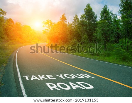Take your road, concept photo of asphalt road. Encouraging quote on road. Summer forest landscape with curved highway. Inspirational quote banner or cover. Motivational card. Mastermind concept