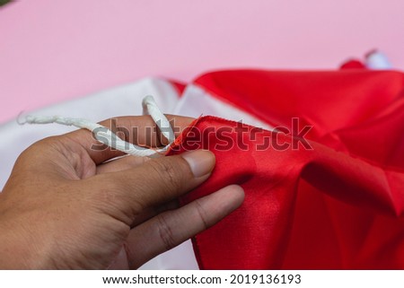 red and white fabric and thread with neat stitches. Indonesian flag. Welcoming the Independence of the Indonesian Nation August 17th.