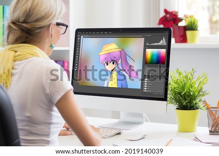 Animator drawing a portrait in image editing software Royalty-Free Stock Photo #2019140039