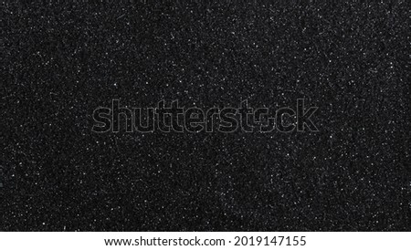 Black glittery textured background design Royalty-Free Stock Photo #2019147155