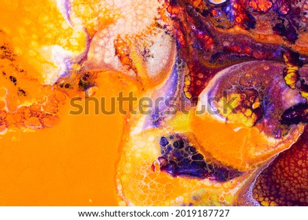 Photography of bright abstract texture of floating mixed paints. Marble background
