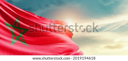 Morocco national flag waving in beautiful sky. Royalty-Free Stock Photo #2019194618