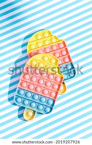 Two antistress ice creams on a stylish background in a dot. Trend 2021. Summer Concept.  Royalty-Free Stock Photo #2019207926