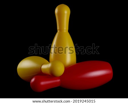 Colorful bowling pins, skittles isolated on black background with clipping path