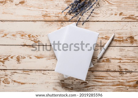 Blank books on wooden table