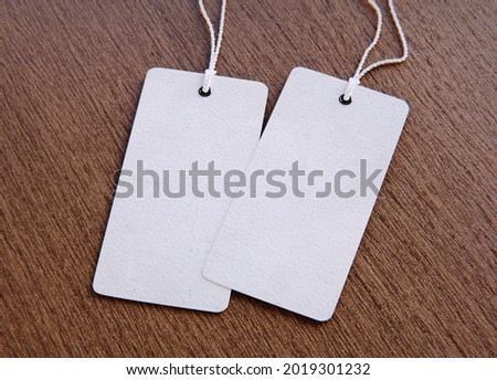 Set of blank tags tied with a string. Price tag, gift tag, sale tag. 