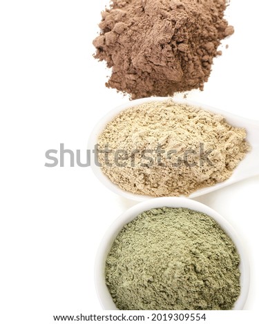 Different henna powder on white background