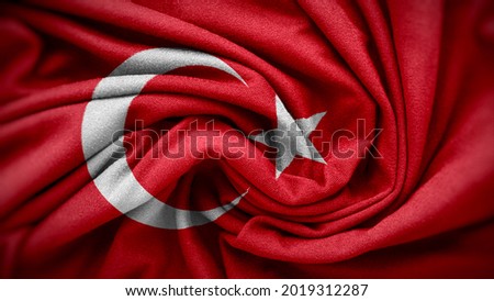The national flag of Turkey. Turkey flag with fabric texture. Close up waving flag of Turkey.