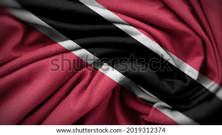 The national flag of Trinidad and Tobago. Trinidad and Tobago flag with fabric texture. Close up waving flag of Trinidad and Tobago.