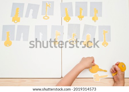 Keys and locks. Find the right key for the right shadow. Montessori style brain exercise game for concentration, attention, memory training.