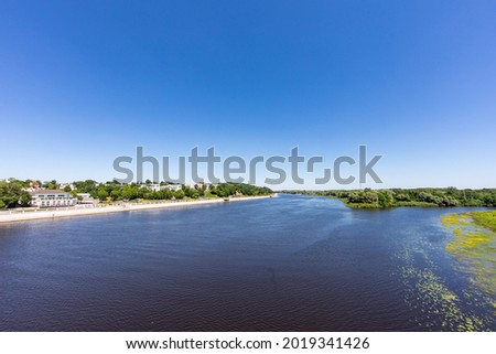 Landscape with a river, forest and embankment in the city in summer. Rivers of Belarus. the city of Gomel. Europe.