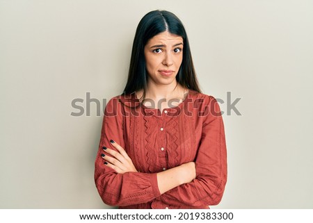 Young hispanic woman wearing casual clothes skeptic and nervous, frowning upset because of problem. negative person.  Royalty-Free Stock Photo #2019383300