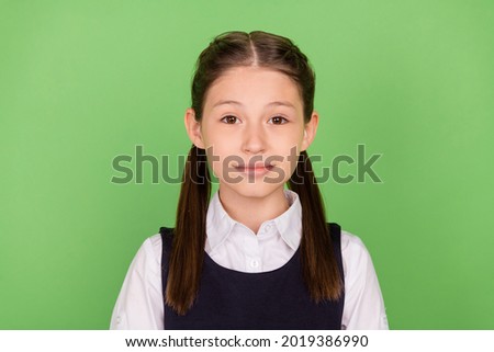 Photo of young school girl happy positive smile confident clever 1-september isolated over green color background